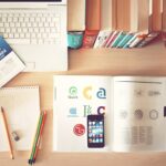 pencils and smartphone on top of books